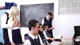 Group Of Students Free Use Eachother Whilst Teacher Teaches