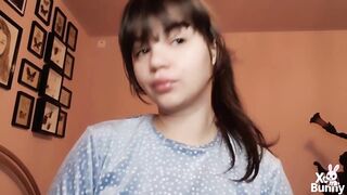 Brunette hair with natural large lips with natural color lipgloss smokin' a cigarette blowing smoke in your face
