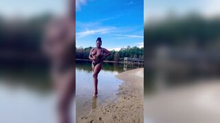 BLACK COUGAR TWERKING ON THE BEACH IN A SWIMSUIT