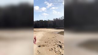 BLACK COUGAR TWERKING ON THE BEACH IN A SWIMSUIT