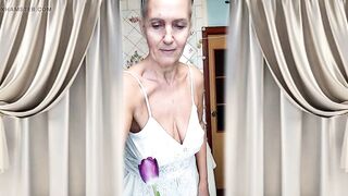 Older housewife Lukerya twerks her curvy figure in white shorts in the kitchen, hawt flirting and teasing movements