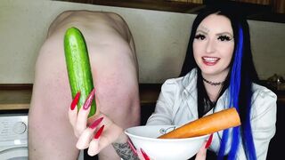 Cook with Dominatrix-bitch Nika. The mistresse prepared carrots and cucumbers for the thrall's asshole. Butt masturbation with vegetables.