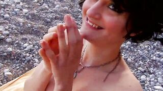 A French brunette hair is drilled on the beach by a hard rod