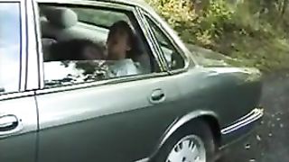 Mature women plays with girl in car