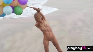 Tiny stripped blondie enjoying the summer at the beach