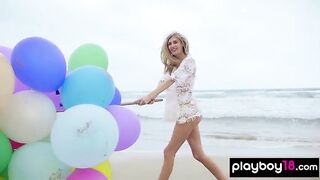 Tiny stripped blondie enjoying the summer at the beach