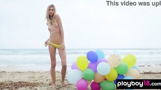 Tiny stripped blondie enjoying the summer at the beach