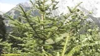 German pair bangs in front of the mountains