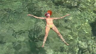 Yellow swimming trunks and blue water