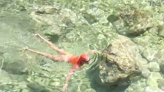 Yellow swimming trunks and blue water