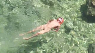 Yellow swimming trunks and blue water