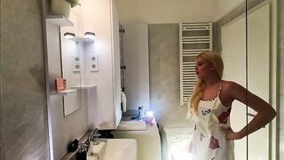 Hawt angel cute golden-haired excited gal in pink pants and with a satin nightie does the washroom routine previous to plan to the couch