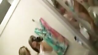 2 girls in changing room. 