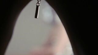 Domina in shiny catsuit gives strapon