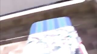 Lady masturbates at the pool 