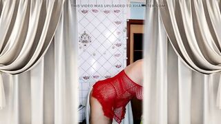 Hawt housewife Lukerya in a red mesh costume flirts and makes coffee in the kitchen.