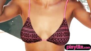 Breasty tiny pretty black honey disrobes exposed by the pool outdoors