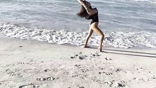 Hot Monika Fox in Ebony Bodysuit on Beach