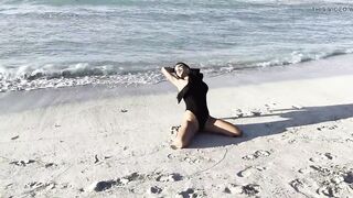 Hot Monika Fox in Ebony Bodysuit on Beach