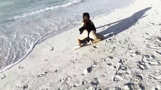 Hot Monika Fox in Ebony Bodysuit on Beach