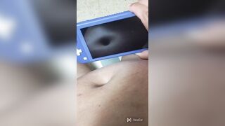 Playing nintendo switch and this babe shove my navel so nice