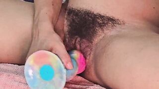 Playing with a large, thick sex-toy