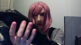 Masked in Anine female mask with pink wig and putting on ebony leather gloves!