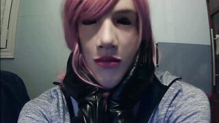 Masked in Anine female mask with pink wig and putting on ebony leather gloves!