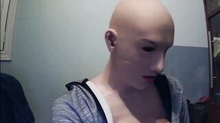 Masked in Anine female mask with pink wig and putting on ebony leather gloves!