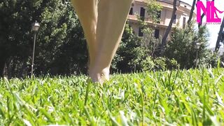 Nyllady Walking Barefoot on Th Grass in a Park