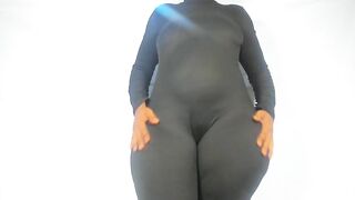 Large Butt clothed in hot one piece constricted suit...