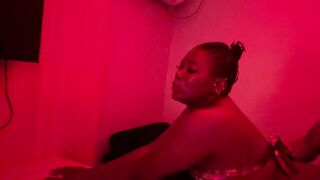 With red light giving a kiss,romance previous to sex at the daybed