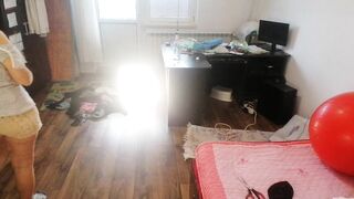 Amateur woman has joy trying on clothing and cutting 'em.