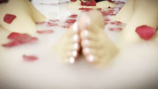 a milk shower with roses, and playing with her feet