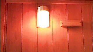 Hawt, taut lesbians play with a double headed vibrator in the sauna