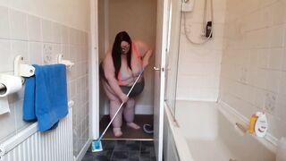 big beautiful woman SSBBW abode chores in suspenders & strap