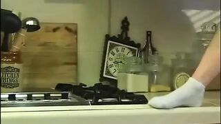 Sexy cheerleader sucking jock in kitchen