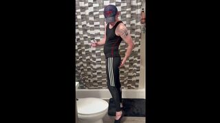 Andrew discharges his load on his Miller hat!