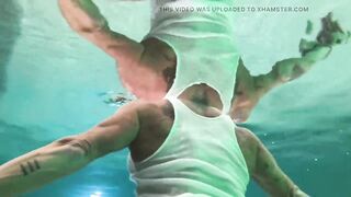 Amazon Kandy Flexes Her Biggest Biceps in Her Hotel Pool