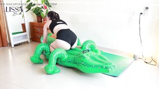 Yoga and Stilettos Destroy the Inflatable Crocodile