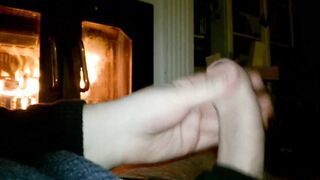 A jack off by the fireplace.