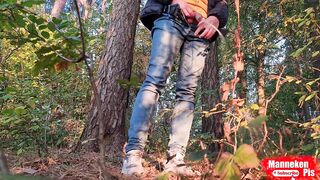Dude lengthy pissing in the forest beneath a tree