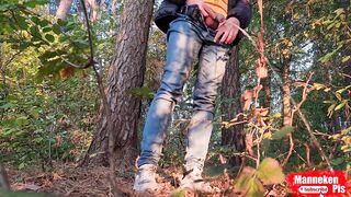 Dude lengthy pissing in the forest beneath a tree