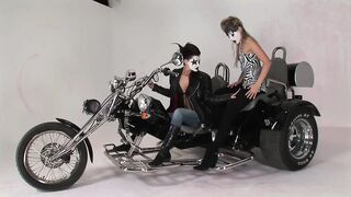 Lesbo Moto Riders with Painted Faces Licking Snatch and Playing with a Vibrator