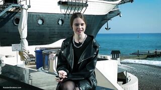 Youthful Russian Woman Smokin' Cigarette Outdoor Terrace