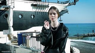 Youthful Russian Woman Smokin' Cigarette Outdoor Terrace