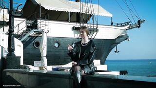 Youthful Russian Woman Smokin' Cigarette Outdoor Terrace