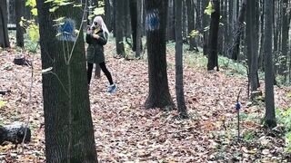 Golden-haired in the Forest Bangs Standing up with a Stranger on Camera