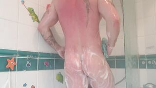 Brawny tattooed chap takes hawt shower after the gym