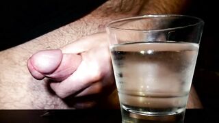Closeup Thick Ejaculation Into a Glass of Cold Water